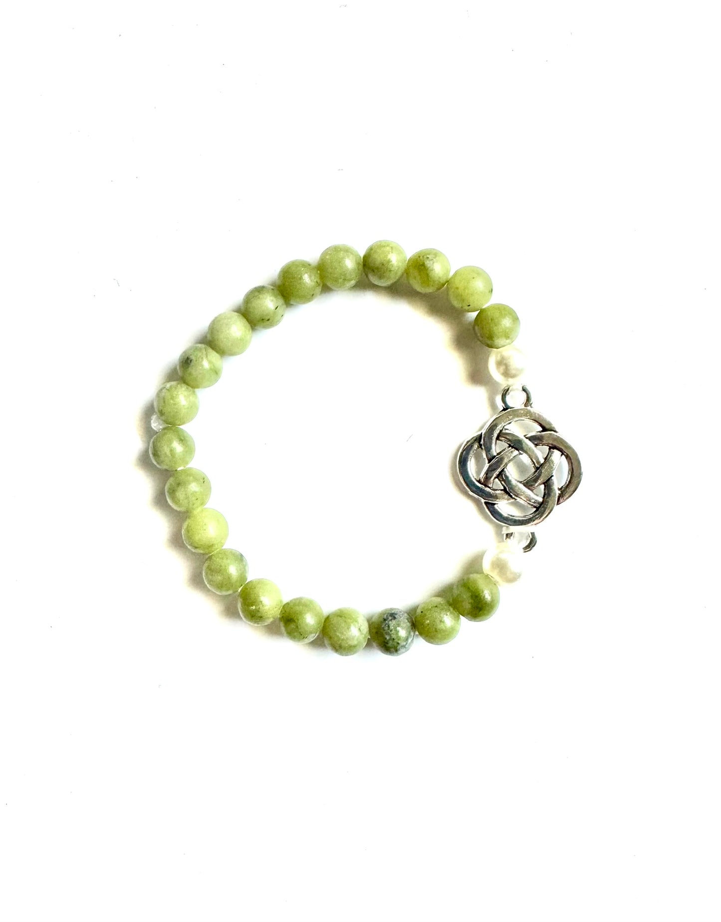 Celtic jade bracelet featuring green stone beads and a silver knot charm for a stylish accessory