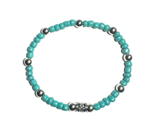 Turquoise Colored Beaded Bracelet with Silver Metallic Accent Spacers