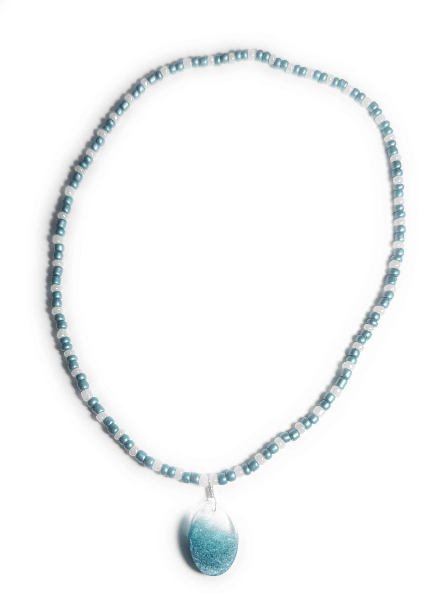 Teal and Pearl Colored Glass Bead Stretchy Necklace with Clear and Blue Resin Pendant