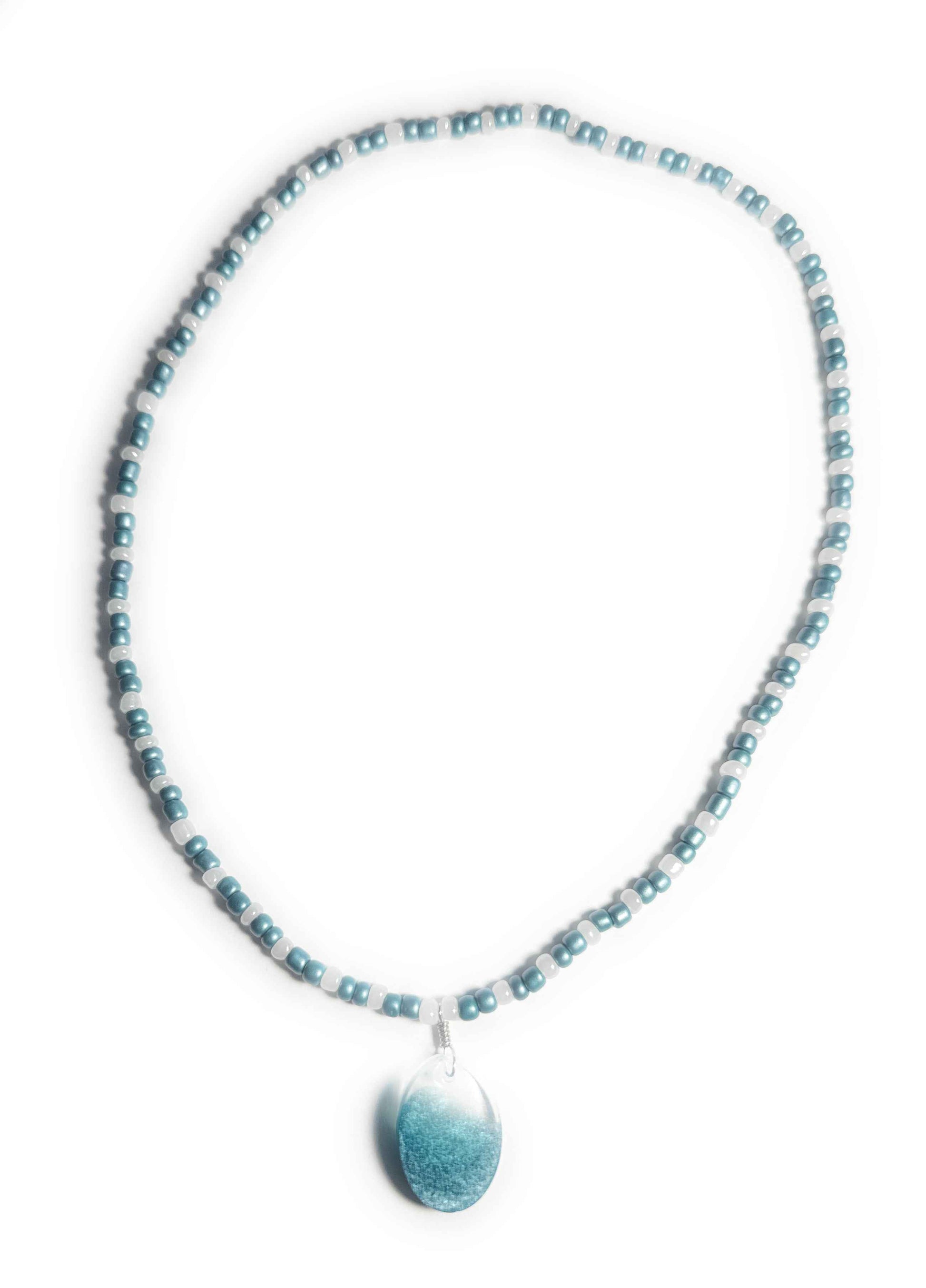 Teal and Pearl Colored Glass Bead Stretchy Necklace with Clear and Blue Resin Pendant