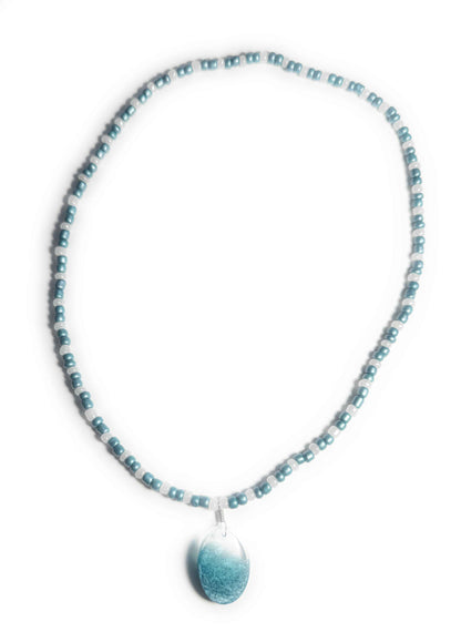 Teal and Pearl Colored Glass Bead Stretchy Necklace with Clear and Blue Resin Pendant