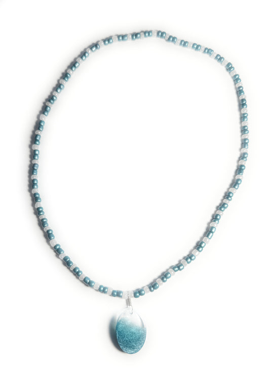 Teal and Pearl Colored Glass Bead Stretchy Necklace with Clear and Blue Resin Pendant