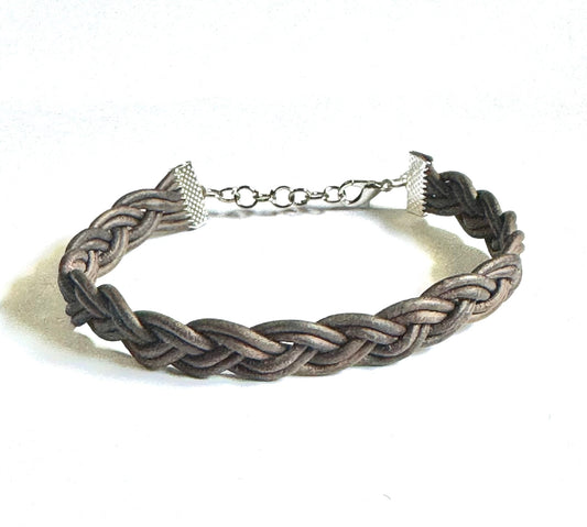 Handcrafted leather bracelet women featuring intricate braided design with adjustable clasp